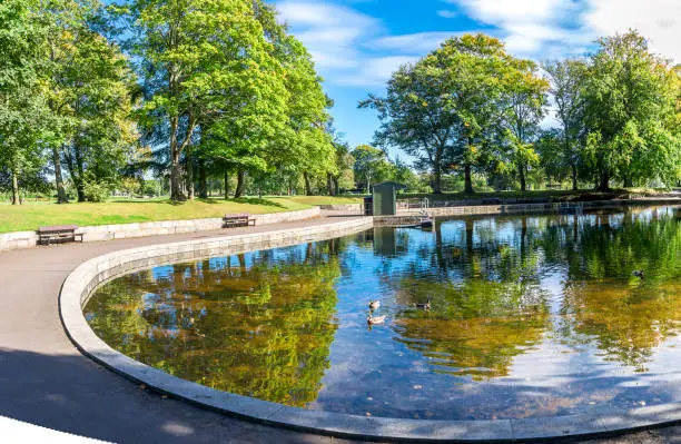 Photo of A view of a small shallow pond in the centre of Duthie Park, Aberdeen, Scotland