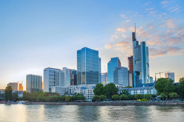 Sunset over Frankfurt-am-Main Sunset by the riverside with business district modern architecture, Frankfurt-am-Main, Germany frankfurt skyline stock pictures, royalty-free photos & images