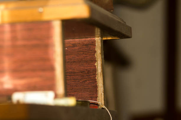 istock Junk tools in the garage. Antique old shelf on the wall. Used boards. 1055281290