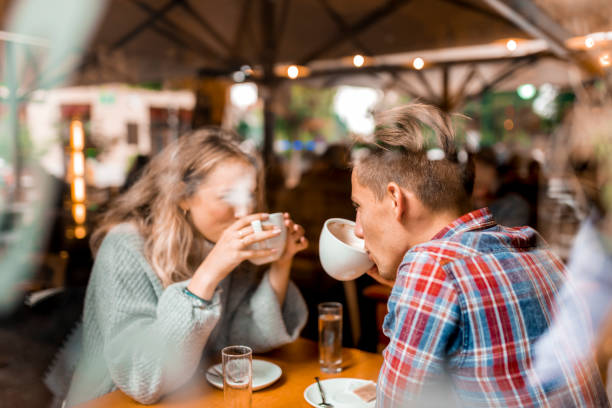 istock Young couple enjoying their coffee in a bar 1055287210