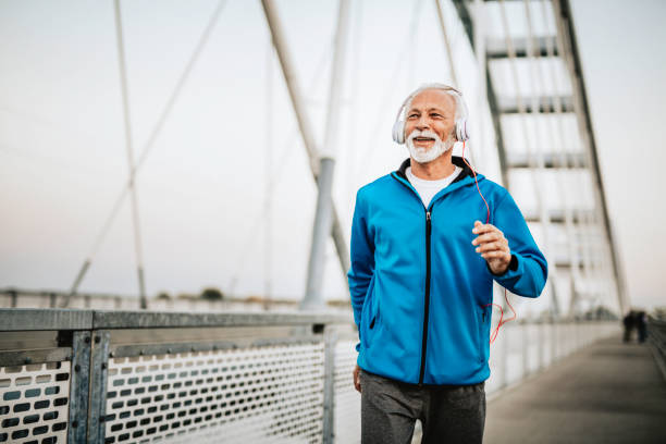 istock Senior man running over the bridge 1055288540