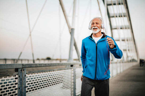 istock Senior man running over the bridge 1055288678