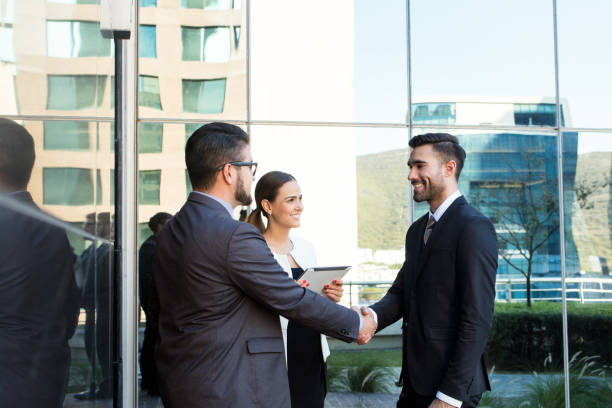 istock Executive team closing deal outside of building 1055291184