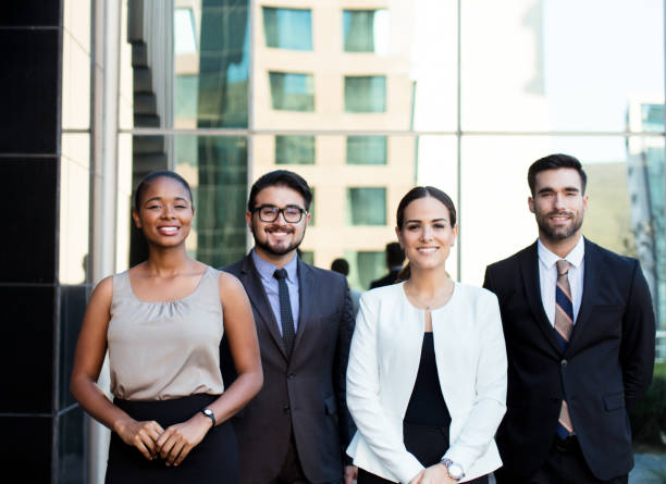 istock Group of young business executives posing outside 1055291194
