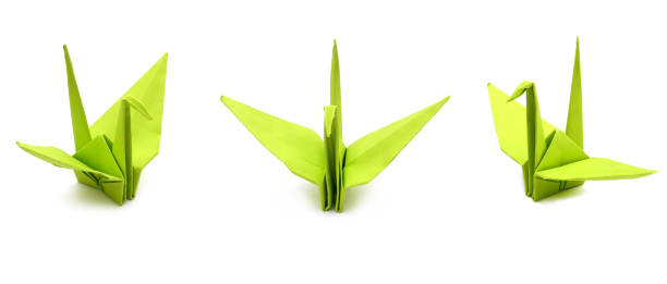 istock A green paper folded Origami crane isolated on white 1055291234