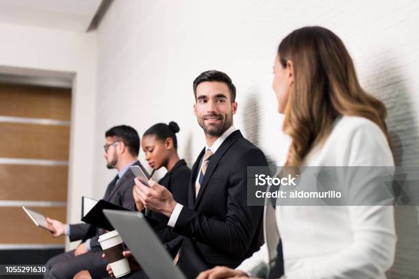 Business Team Sitting In Waiting Room And Talking Stock Photo - Download Image Now - Adult, Adults Only, African Ethnicity