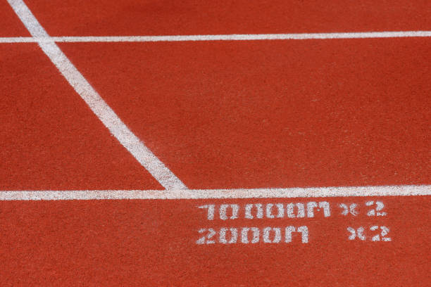 istock Close up of Running track pattern background in stadium. 1055292760