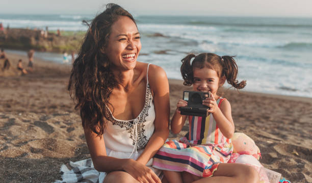 istock Happy family on beach 1055294300