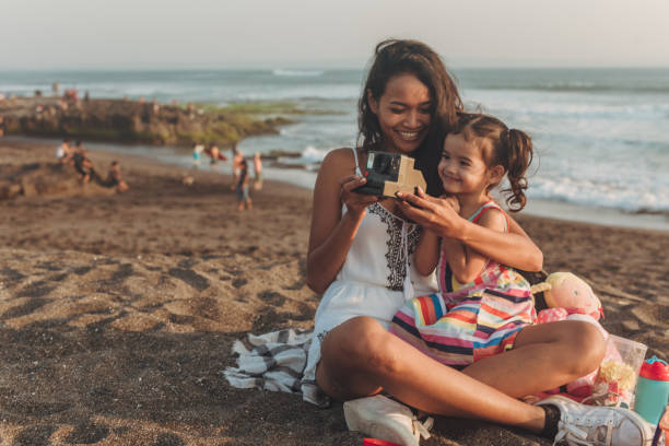 istock Cute family on the beach 1055295426