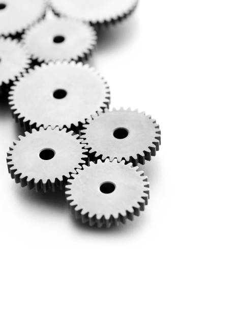Engine Gears Machine gears on white background with copy space. clockworks photos stock pictures, royalty-free photos & images