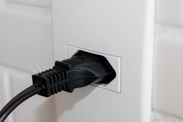 istock Close-up  eletrical power socket outlet three (3) pin and plug socket - Brazilian standard - Brazil 1055302200
