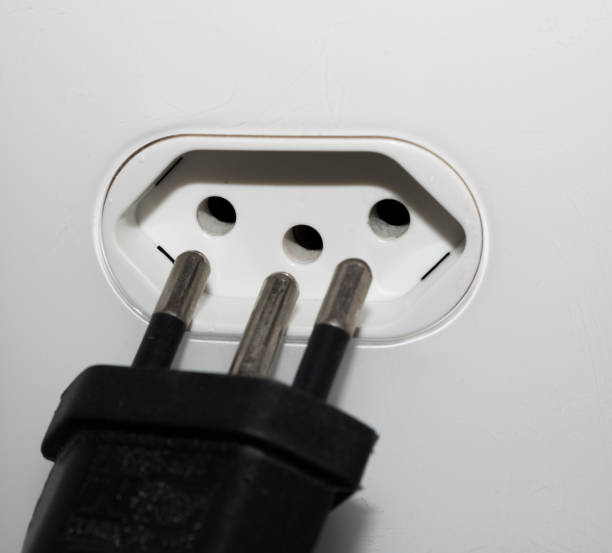 istock Close-up  eletrical power socket outlet three (3) pin and plug socket - Brazilian standard - Brazil 1055302228