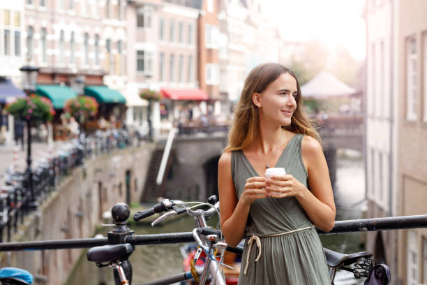 istock Young Woman Enjoying Coffee Break 1055304170