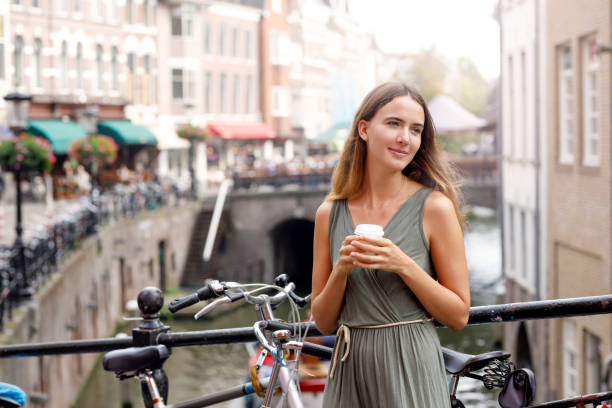 istock Young Woman Enjoying Coffee Break 1055304194