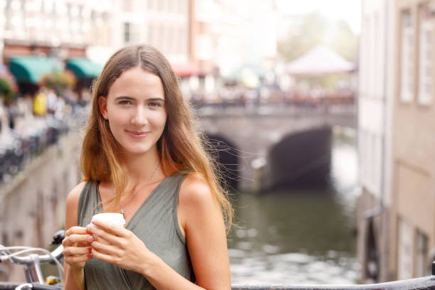 istock Young Woman Enjoying Coffee Break 1055304214