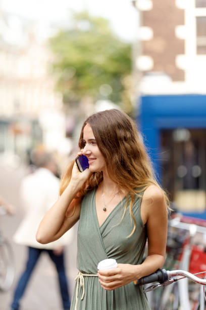 istock Young Woman Talking On Smart Phone 1055304232