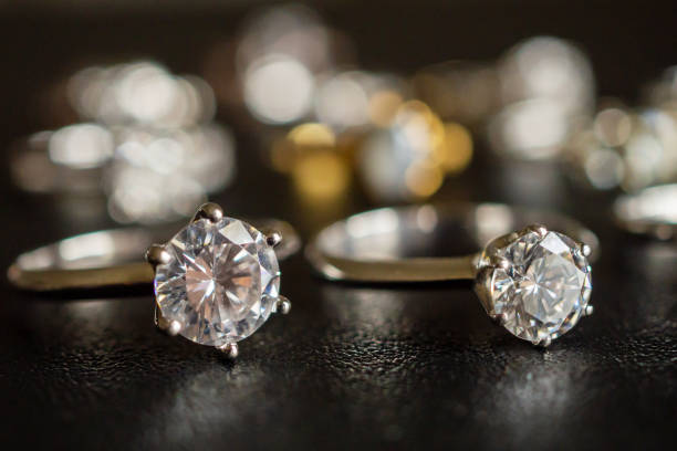 istock Jewelry diamond rings set on black background close up 1055312376