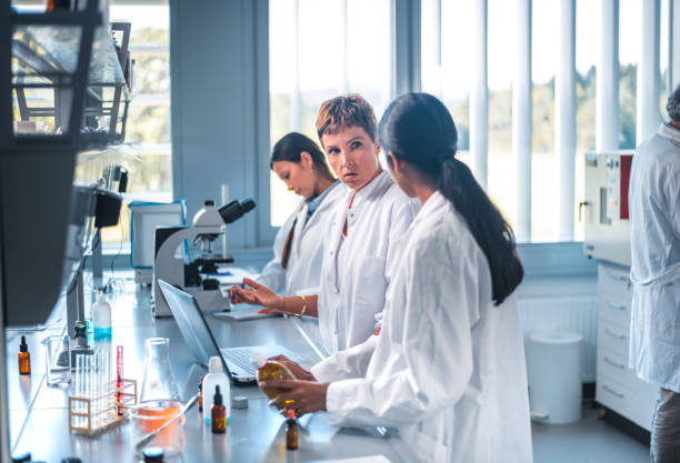 istock Female scientist having discussion with colleague 1055312572
