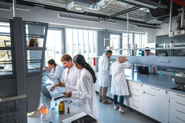 istock Researcher discussing with colleague in laboratory 1055312582