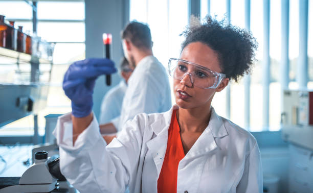 istock Scientist looking at blood sample in laboratory 1055312626