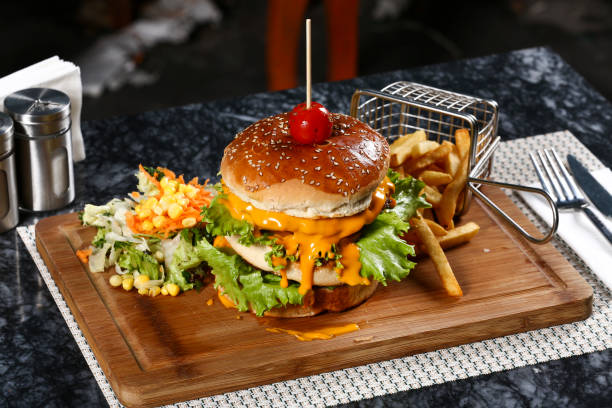 istock Tasty burgers on table 1055314424