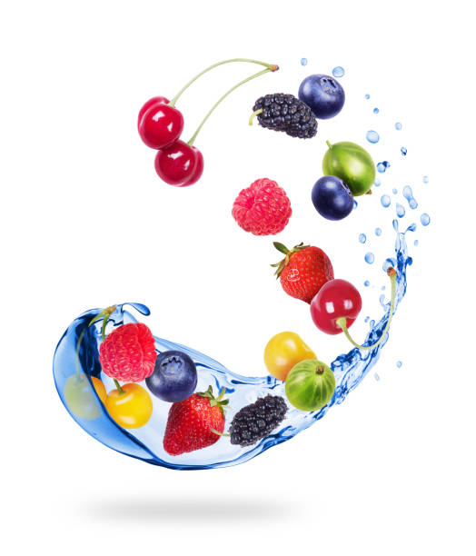 istock Different berries with splashes of water isolated on white background 1055317476