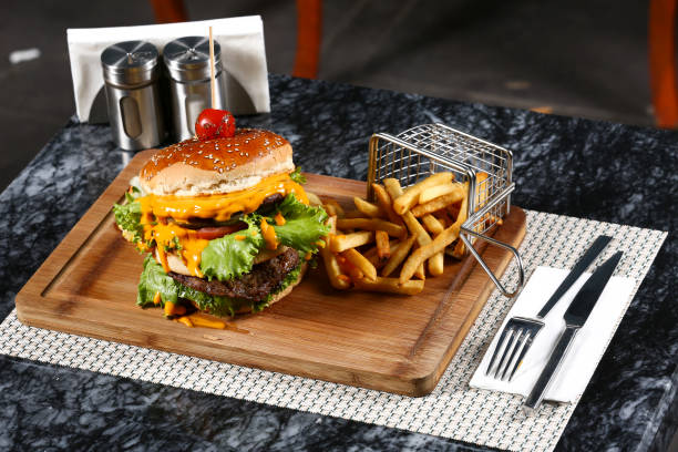 istock Tasty burgers on table 1055317758
