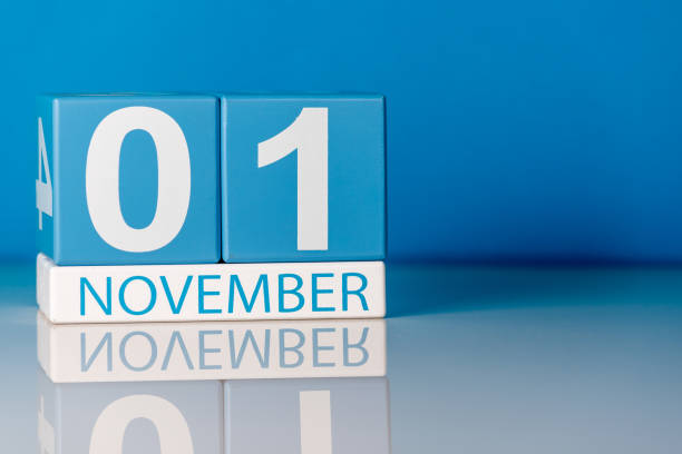istock November 1st. Image of november 1 calendar on blue background. Empty space for text 1055327602