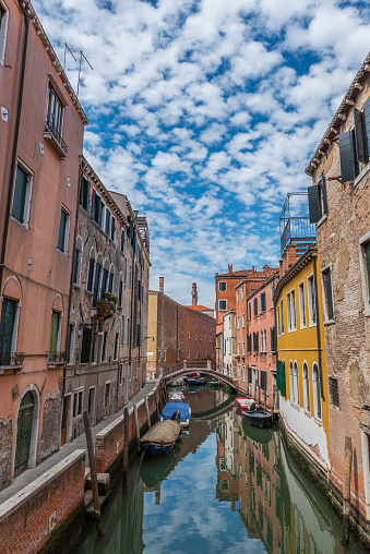 Typical street of Venice. Motorboats moored not far from the central water street without tourists, Italy.