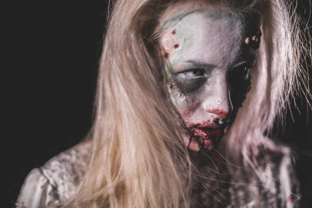 istock Terrifying witch with bloody mouth 1055334170