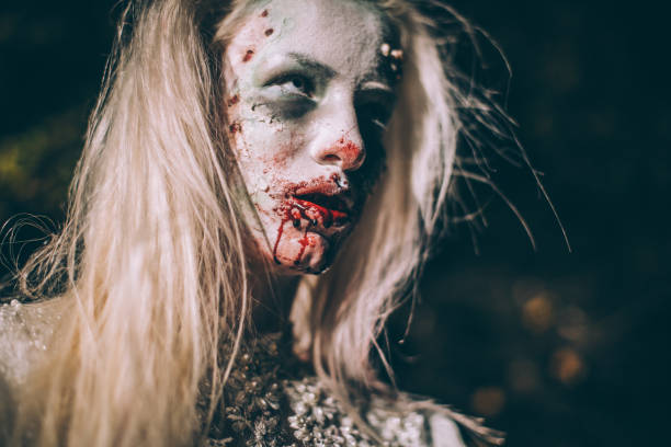istock Spooky witch with bloody mouth 1055334220