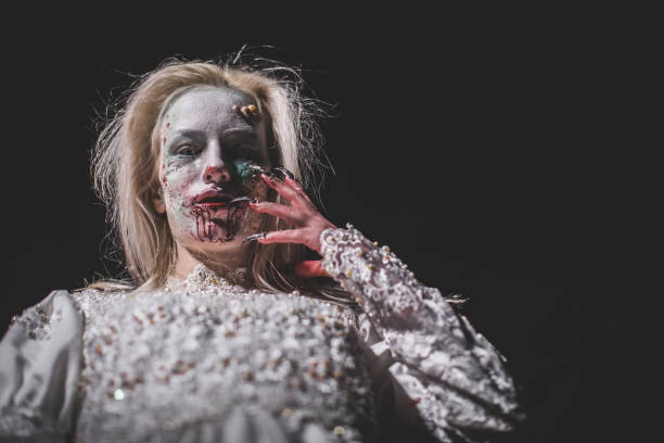 istock Zombie witch with bloody mouth 1055334250