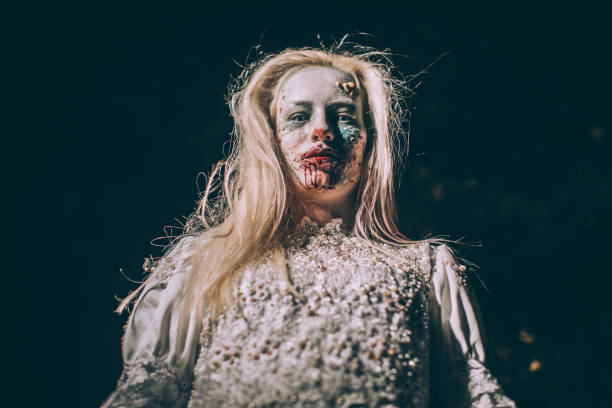 istock Zombie witch in white dress 1055334272