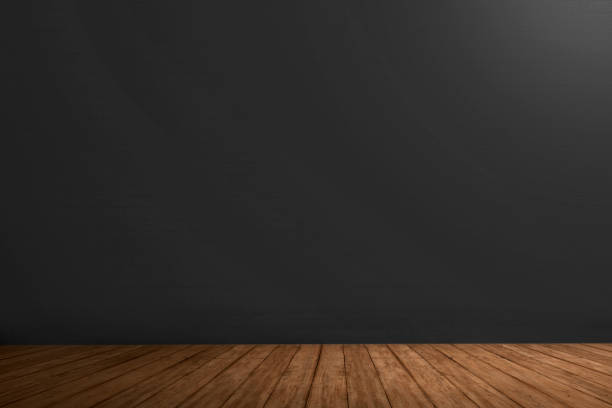 istock Black wall and wooden floor 1055338844