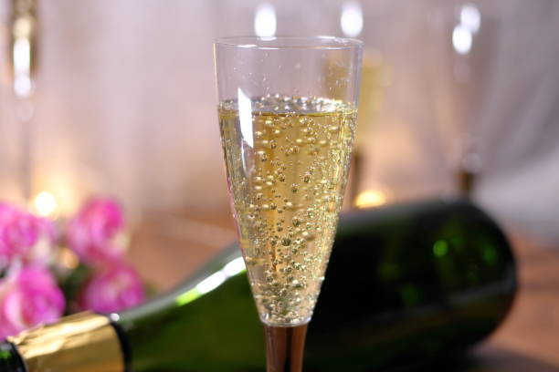istock champagn glass and Empty champagne bottle 1055345164