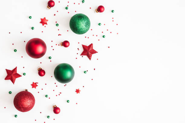 istock Christmas composition. Christmas red and green decorations on white background. Flat lay, top view, copy space 1055345180