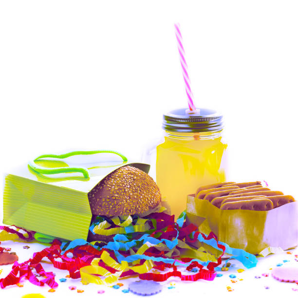 Surrealism Festive composition drinks snacks holiday hamburger cookie tinsel confetti gift box cocktail saturated colors. Children's holiday birthday party