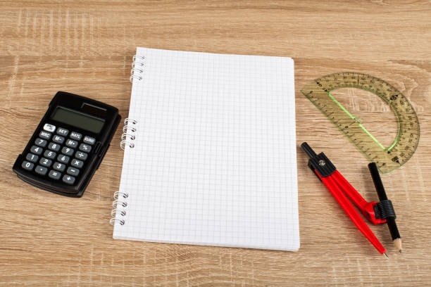 istock School supplies on wooden background 1055357200