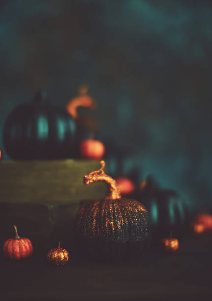 istock Glittery Halloween Background with Black and Orange Pumpkins 1055361002