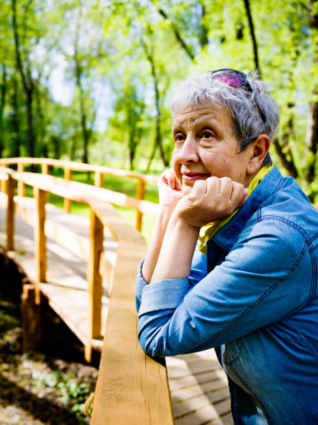istock Nice senior woman enjoying springtime 1055367964