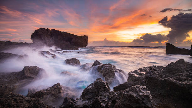 istock Rocky sunset seascape 1055371328