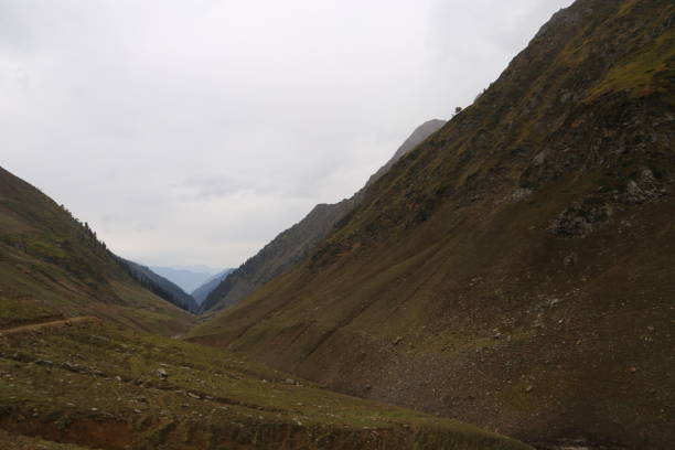 istock Beautiful Tracks on big mountains in kashmir under cloudy sky 1055371402