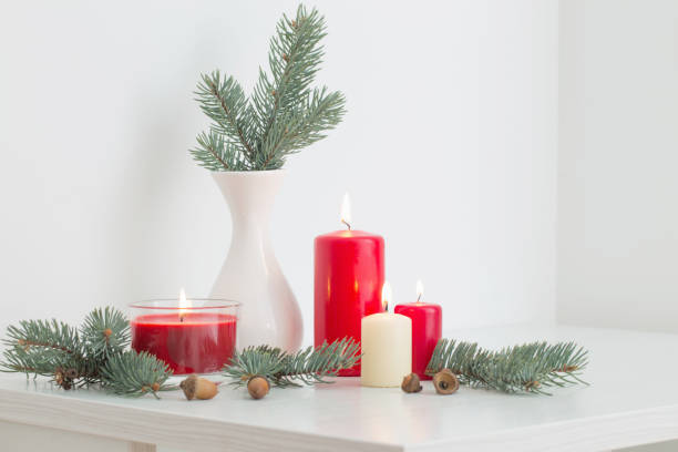 istock Christmas decoration with candles on white background 1055379896