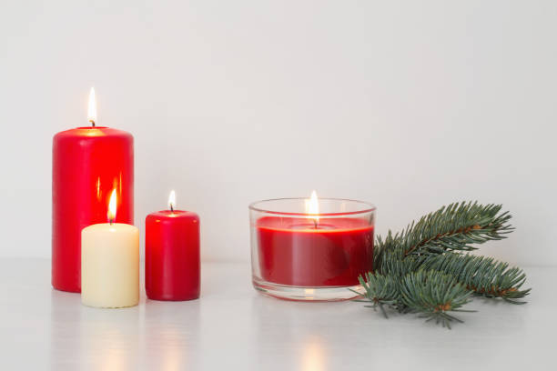 istock Christmas decoration with candles on white background 1055379900