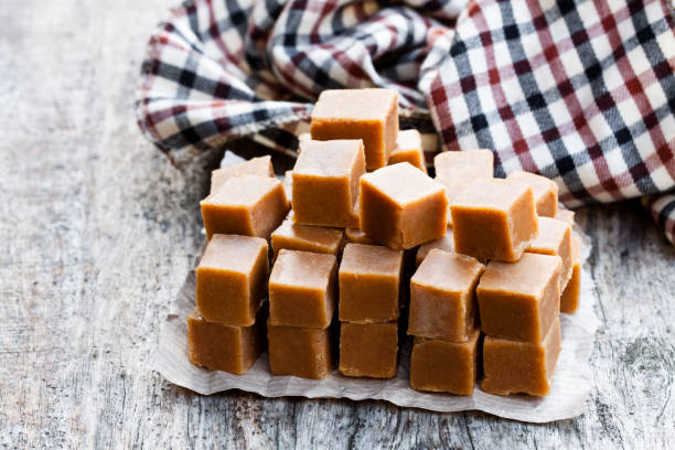 istock Toffee cubes on wooden table 1055387422