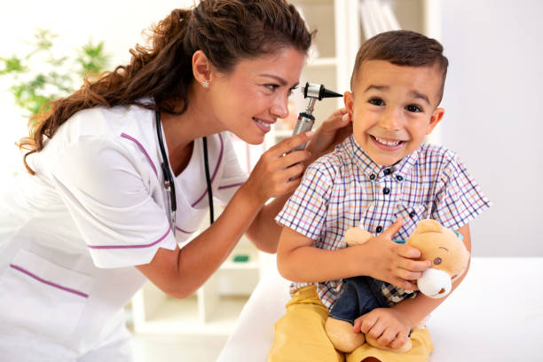 istock Dedicated doctor examining her patients ear 1055387508