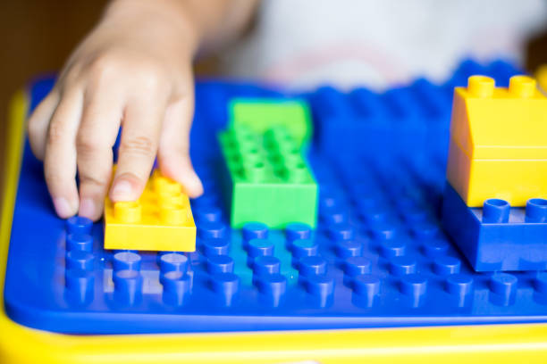 istock child playing colorful toys on table 1055387866