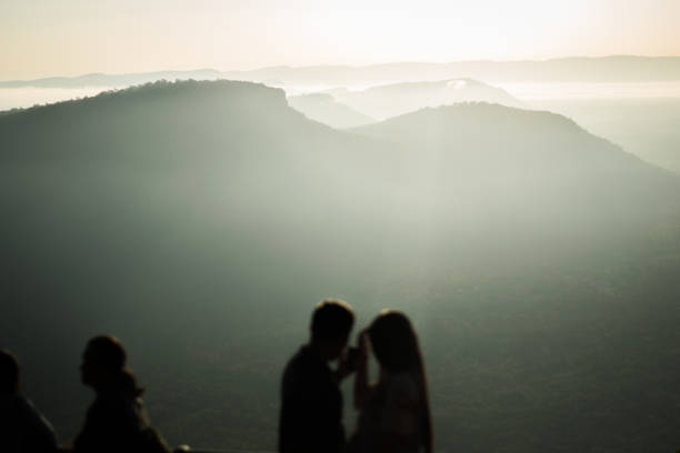 istock silhouette travel people on mountain view 1055387980