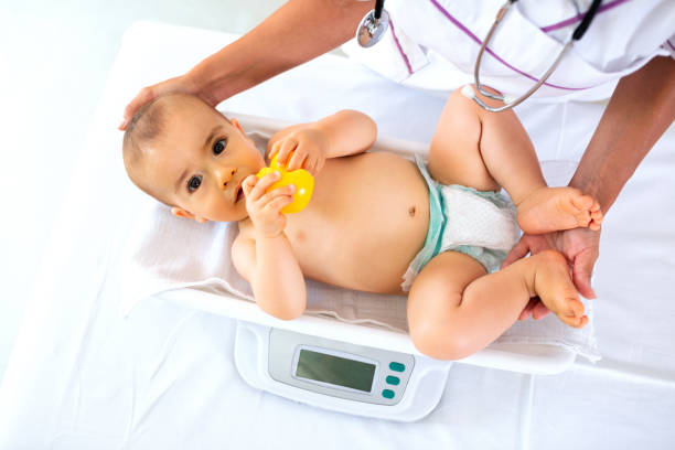 istock A pediatrician doing weight measurement 1055388164