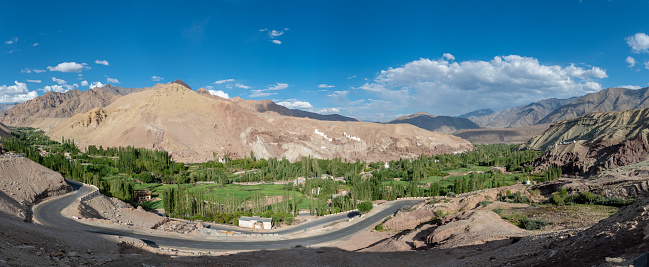 Landscape of range mountains and road with blue sky and clouds in Leh, Ladakh, India.